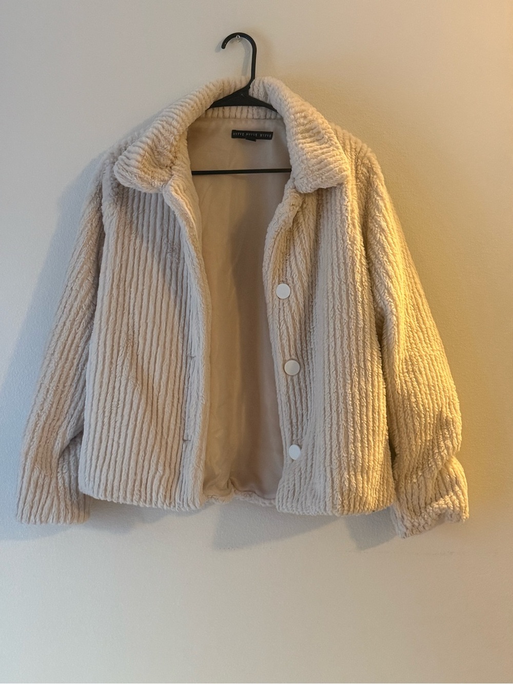 Classy beige colored fluffy jacket